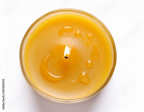 Wallpaper Mural melted yellow candle top view with oozing wax drops isolated on white background for wellness or spa design Torontodigital.ca