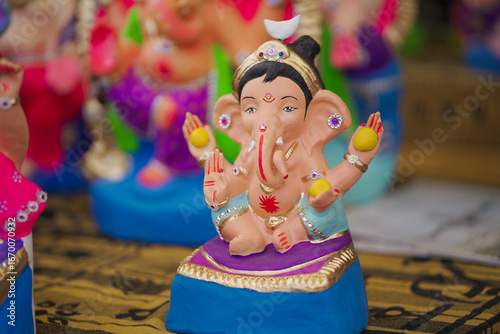 Photography Lord Ganesha idol for Ganesh Chaturthi festival in India, Colorful Ganpati statue Stock Photo, Lord Ganesha murti
