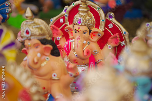 Photography Lord Ganesha idol for Ganesh Chaturthi festival in India, Colorful Ganpati statue Stock Photo, Lord Ganesha murti