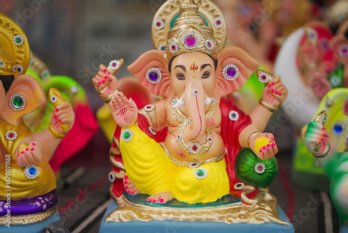 Photography Lord Ganesha idol for Ganesh Chaturthi festival in India, Colorful Ganpati statue Stock Photo, Lord Ganesha murti