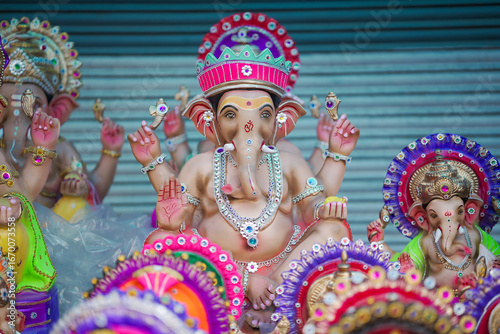 Photography Lord Ganesha idol for Ganesh Chaturthi festival in India, Colorful Ganpati statue Stock Photo, Lord Ganesha murti