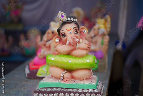 Photography Lord Ganesha idol for Ganesh Chaturthi festival in India, Colorful Ganpati statue Stock Photo, Lord Ganesha murti