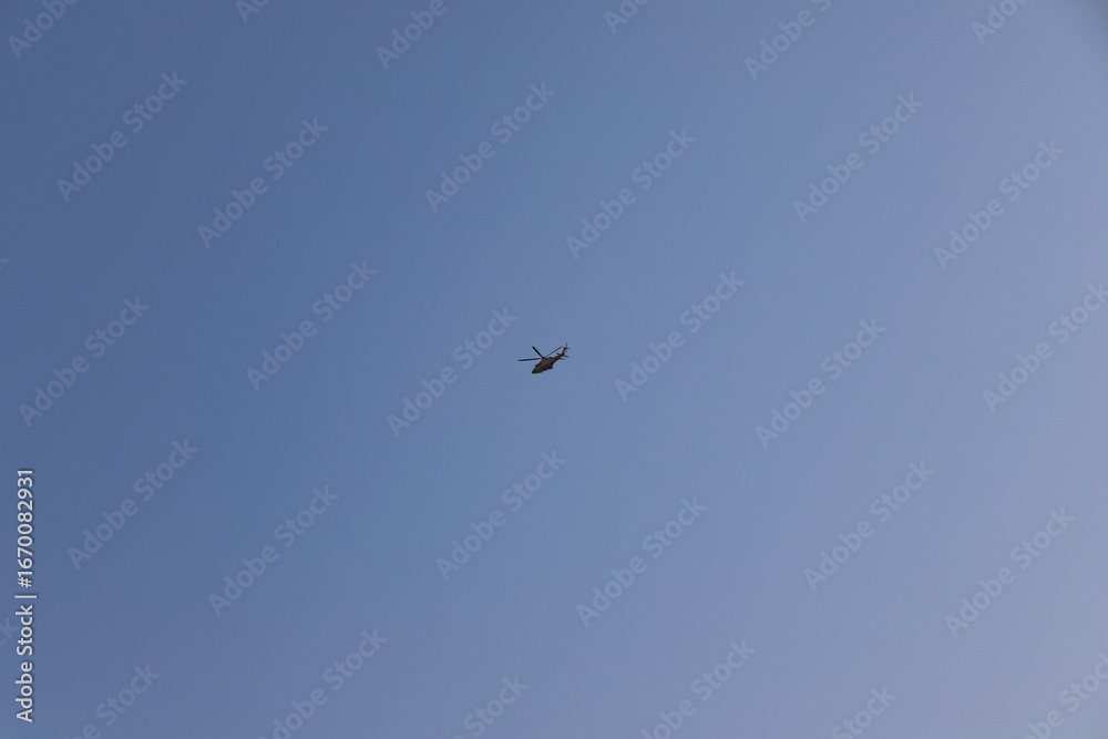 Helicopter flying in the sky. Viareggio Italy. Helicopter flying in the sky. Viareggio Italy.
