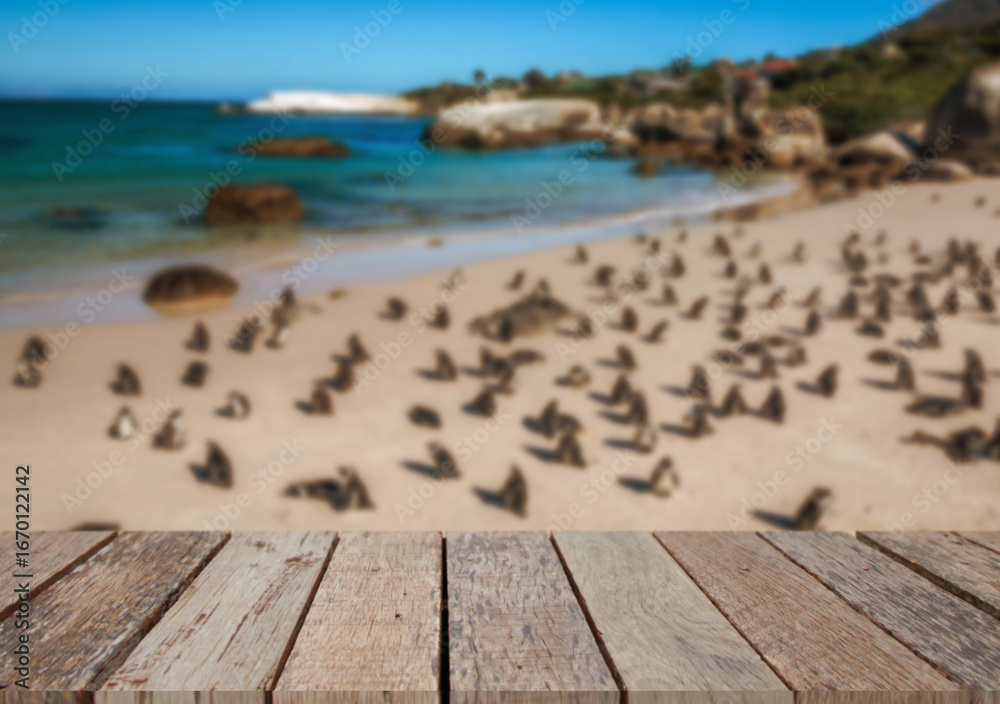 Fototapeta premium Wooden table top on the beach or sea.Party on the beach sunshine time concept.For montage product display or design key visual layout.View of copy space.