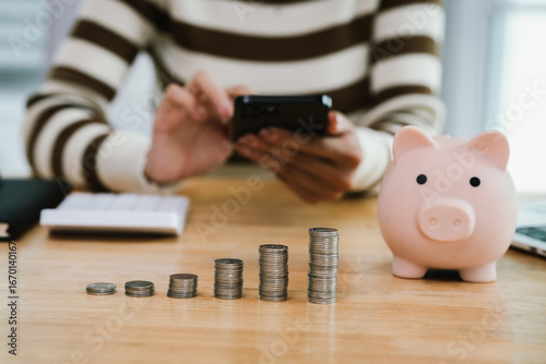 A woman holds a piggybank, symbolizing saving, retirement planning, financial security, investment growth, budgeting, wealth management, and future prosperity.