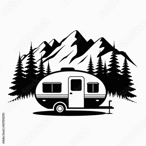 Vintage camper trailer surrounded by pine trees and mountains