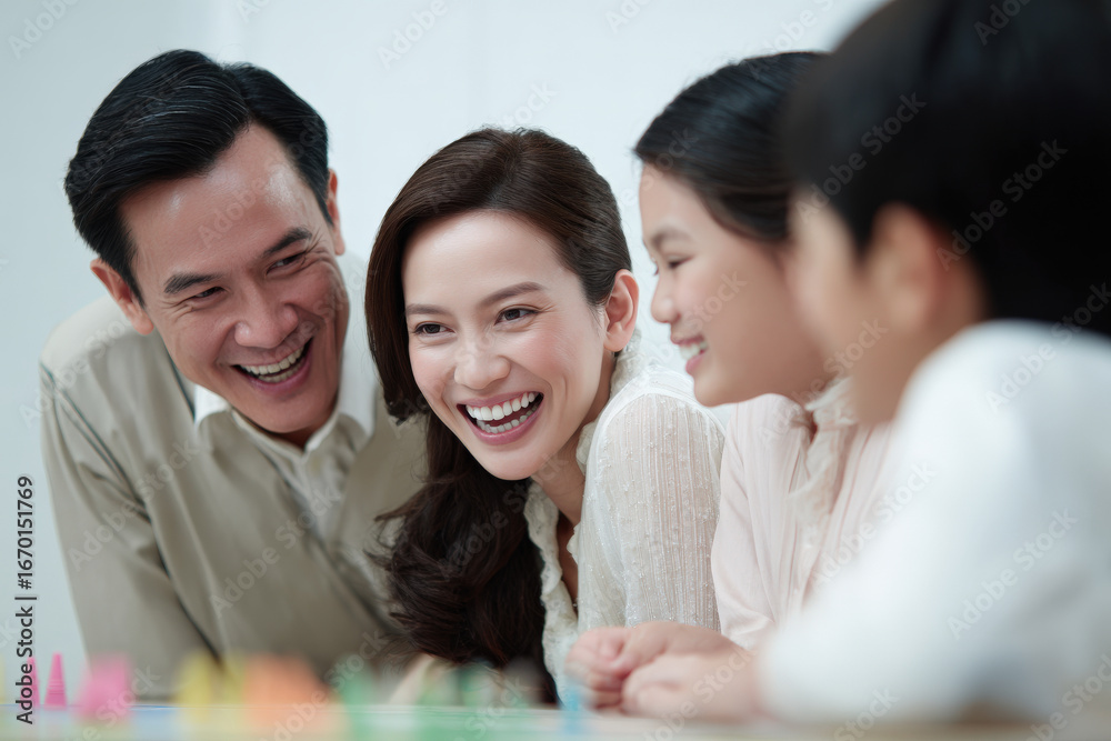 Fototapeta premium joyful family gathering around tabletop game laughter filling room as people share lighthearted moments
