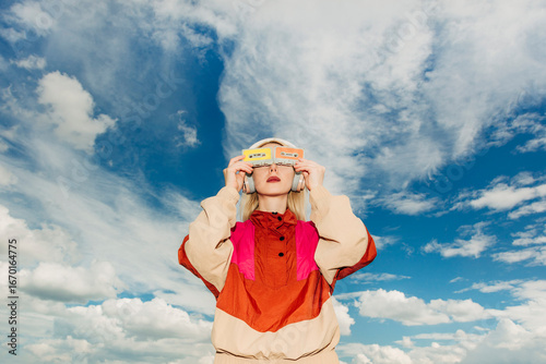 Retro woman in vibrant sportswear listening to cassette music outdoors