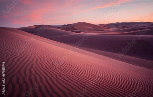 Sand dunes with neon lines tracing their curves. 