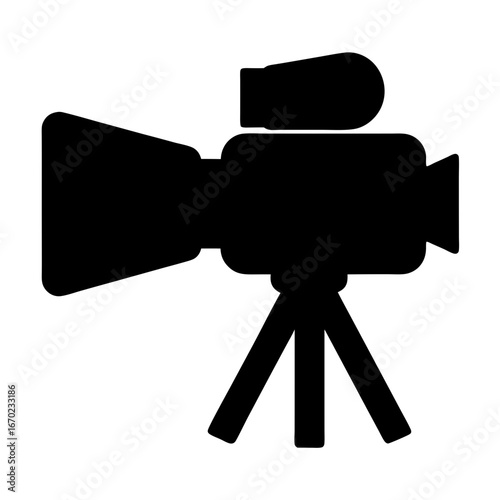 Silhouette of a vintage video camera on a tripod used for filming