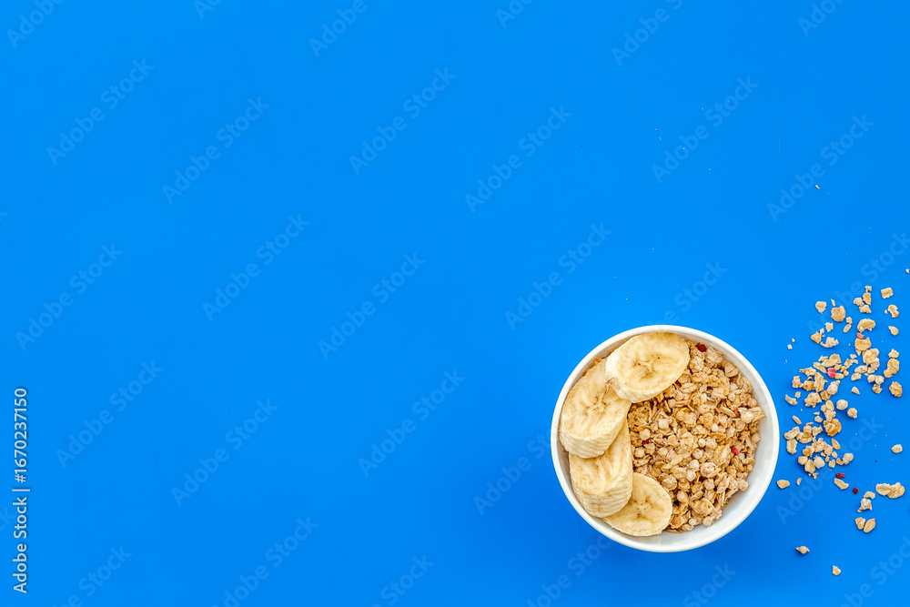 Fototapeta premium food for healthy breakfast with granola on blue background top view mock up