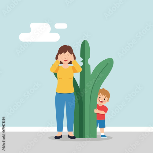 Woman and child playing hide and seek behind a large plant.