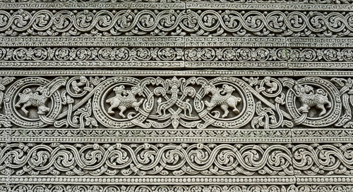 Intricate Stone Carvings Featuring Mythical Creatures and Swirli