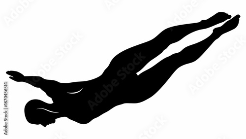 Silhouette of a diver in mid air with arms outstretched and legs extended in a streamlined position