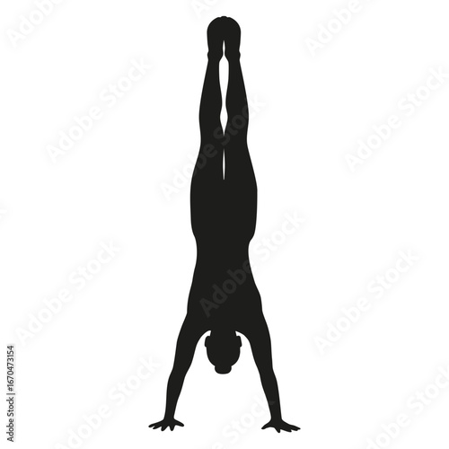 Silhouette of gymnast performing handstand exercise