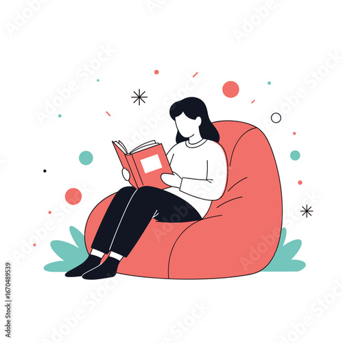A person relaxing reading a book while sitting on a large beanbag chair