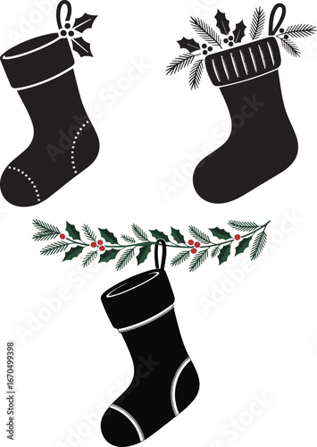Black christmas stocking filled with festive pine branches and holly berries