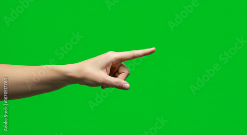 Confident hand pointing forward, showcasing direction and action on a vibrant green screen backdrop.