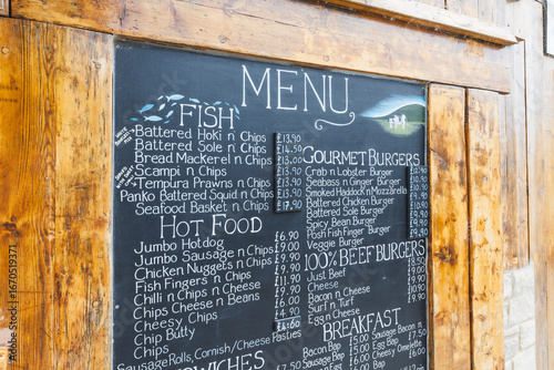 Bilde på lerret Rustic chalkboard cafe menu with handwritten specials on wooden frame outside re