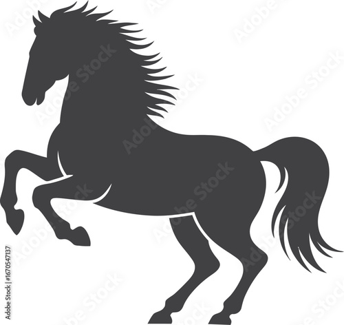 Silhouette of a powerful horse rearing up on its hind legs