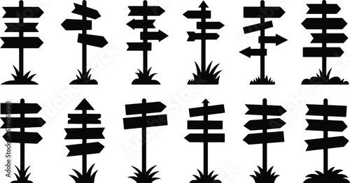 Collection of silhouette directional signposts with grass accents