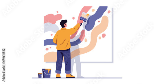 A man in a yellow shirt and blue pants is actively painting a large canvas with abstract colorful shapes using a paintbrush.