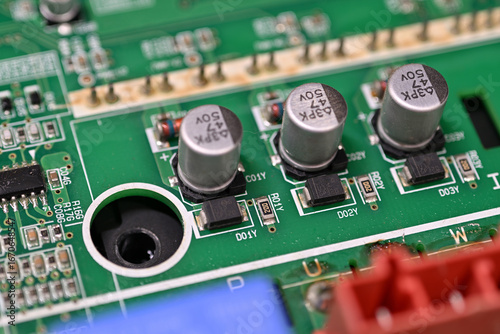 Wallpaper Mural Close-up of rectifier diodes next to capacitors on a printed circuit board.
 Torontodigital.ca
