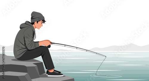 Young Man Enjoying Serene Moment Fishing By the Lake On Rocky Outcrop
