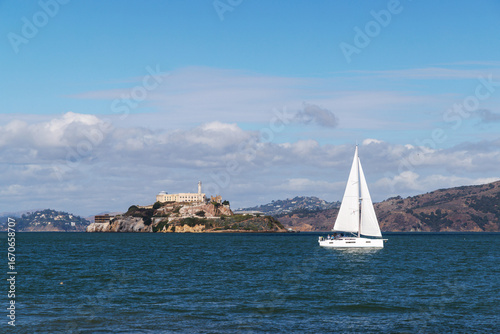 Scenic San Francisco landscape with Alcatraz Island and a yacht sailing in the bay