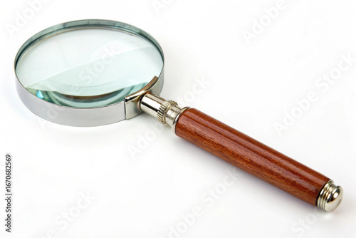 Classic magnifying glass with wooden handle on white background