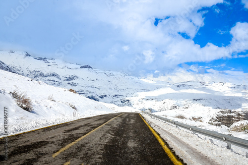 Road leading to Valle Nevado in Chile with dramatic sky