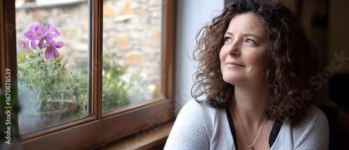 Dreamy Woman by Window, Curly Hair, Peaceful Scene