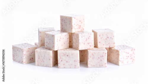 Stacked taro cubes with pink speckles on a clean white background