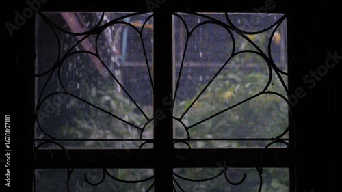 Wallpaper Mural A window with a metal frame display bad weather make moody day from rain storm and rain falling Torontodigital.ca