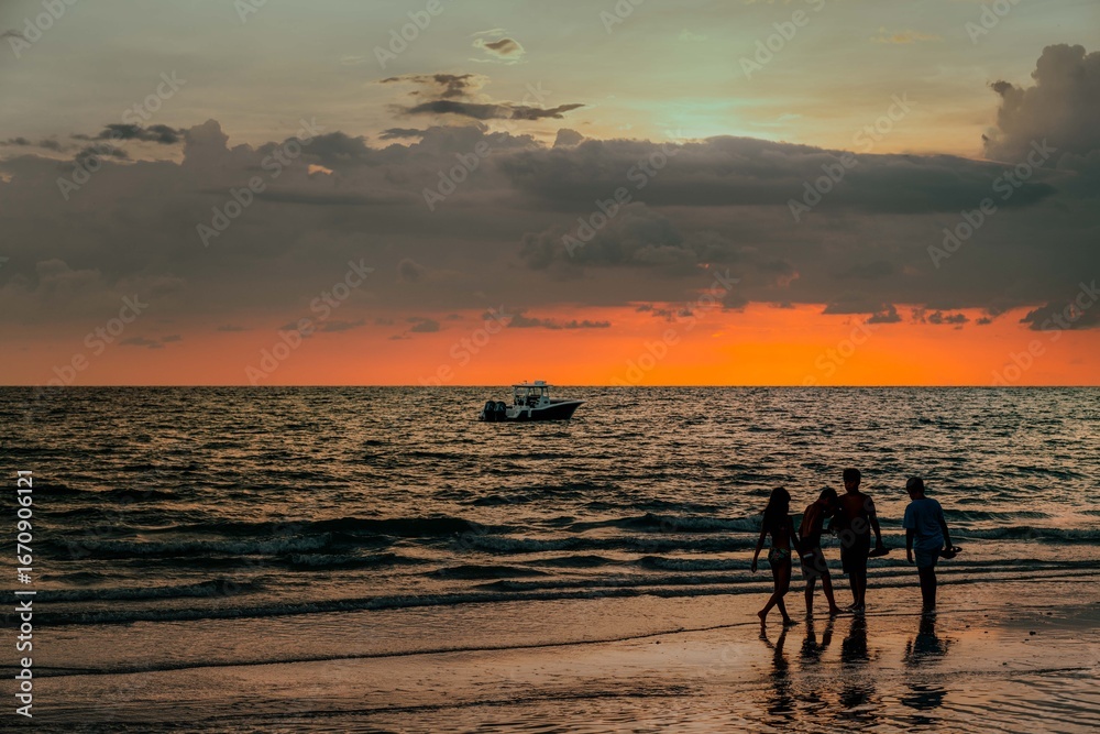 Fototapeta premium sunset at the beach with pals