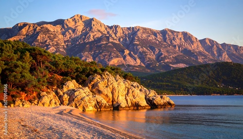 Fototapeta Naklejka Na Ścianę i Meble -  Golden Hour Coastal Mountain View.