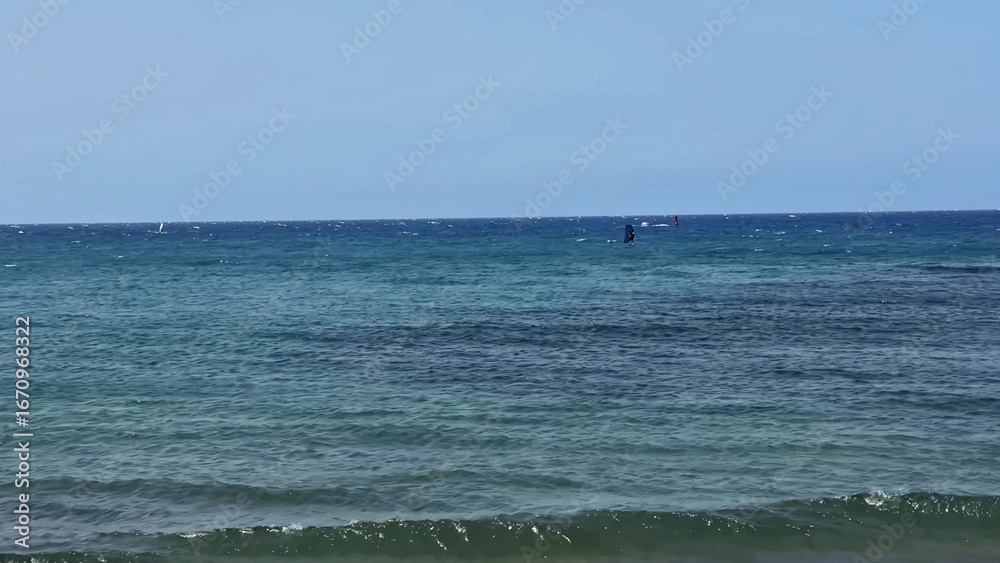 Fototapeta premium Experience a Serene Ocean View with Gentle Waves, Crystal Waters, and Clear Beautiful Skies