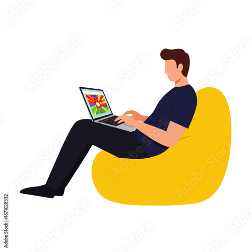 Man sitting in a yellow beanbag chair using a laptop with a landscape image displayed on the screen.