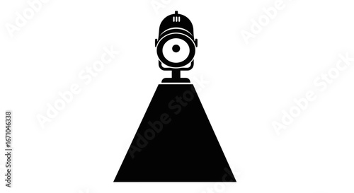 A black and white icon of a theatrical spotlight on a stand, casting a strong beam of light downwards against a white background.