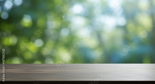 A wooden table in the foreground with a blurred green bokeh background