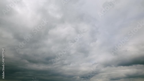 An overcast sky filled with clouds creates a moody atmosphere that captivates viewers