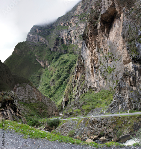 beautiful natural landscape with a ravine next to the road