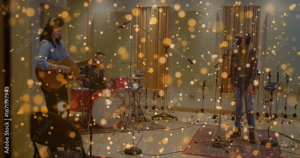 Naklejka premium Three musicians jamming together in recording studio, with acoustic guitar and drum kit