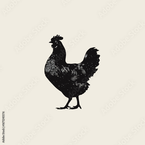A solitary black silhouette of a chicken stands on a plain background, showcasing its distinctive shape and posture. The chicken appears alert, with its head turned to one side.