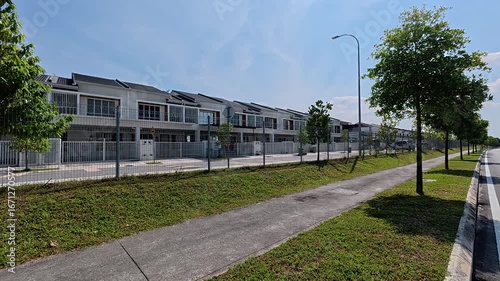 Wallpaper Mural A modern terraced housing area in Malaysia with clean, green landscaping. The gated community features a variety of essential amenities and is free of trash. Torontodigital.ca