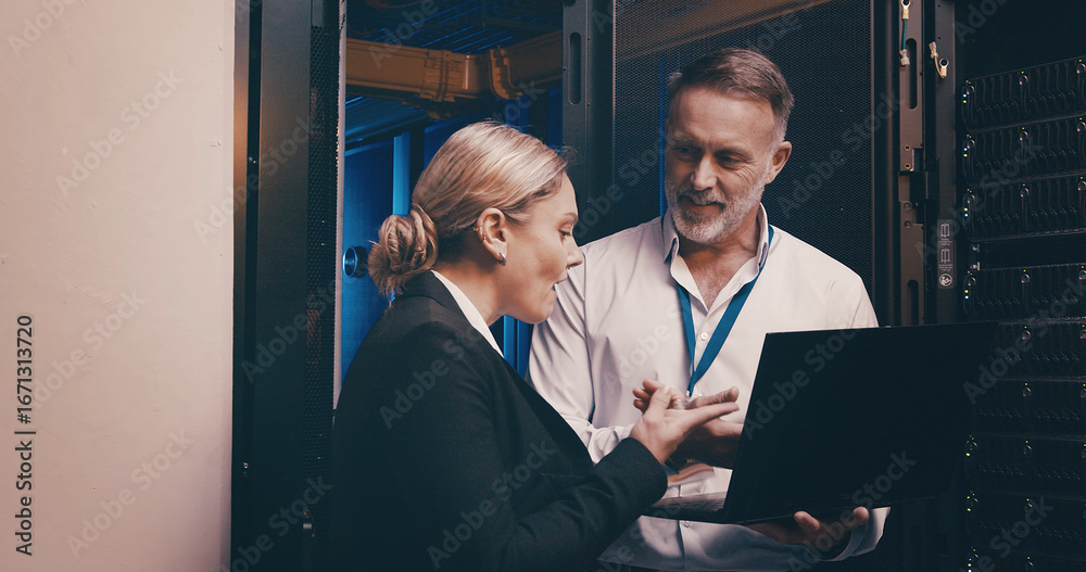 Fototapeta premium Laptop, discussion and people with in server room for technical support, database or cybersecurity. Computer, teamwork and technicians with system upgrade in data center for network programming.