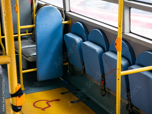 Wheelchair accessible space and designated area for disabled passengers on public transportation bus or train - barrier-free inclusive transit design.
