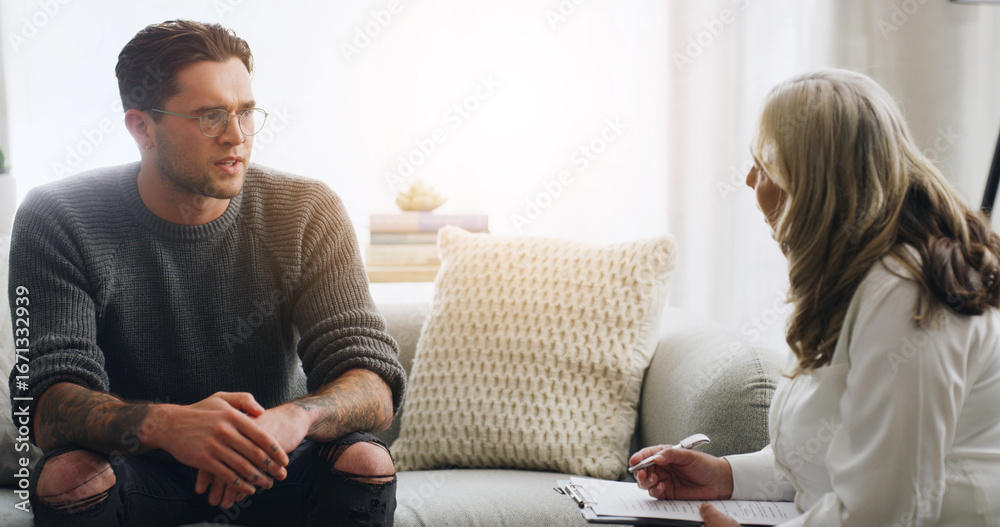 Obraz premium Chat, therapy and people on sofa in counseling session for mental health, assessment and support. Patient report, psychologist diagnosis and treatment plan with man and woman in office for healing