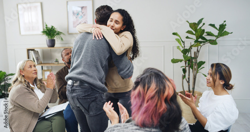 Photos Hug, applause and therapy with people in support group for sobriety millstone, community and success