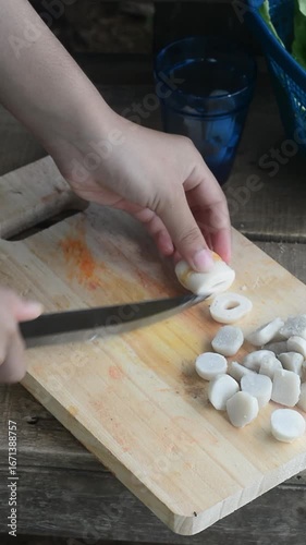 Preparing vegetables and herbs for tom yum soup in a countryside environment. Fresh ingredients and natural cooking atmosphere.